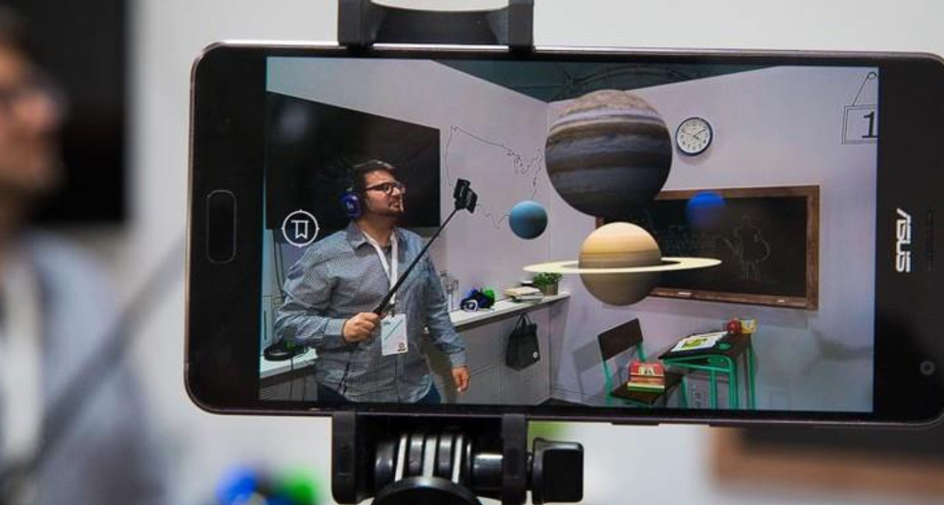 Immersive Technologies Skillnet guy using iPhone to film planets on a selfie stick